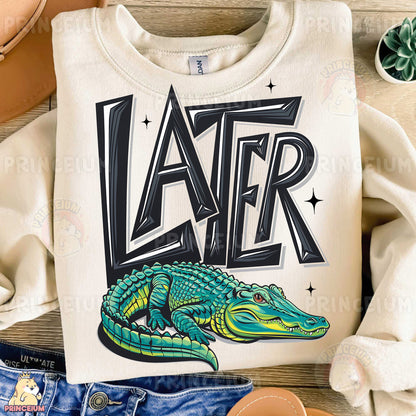 a white shirt with a green alligator on it