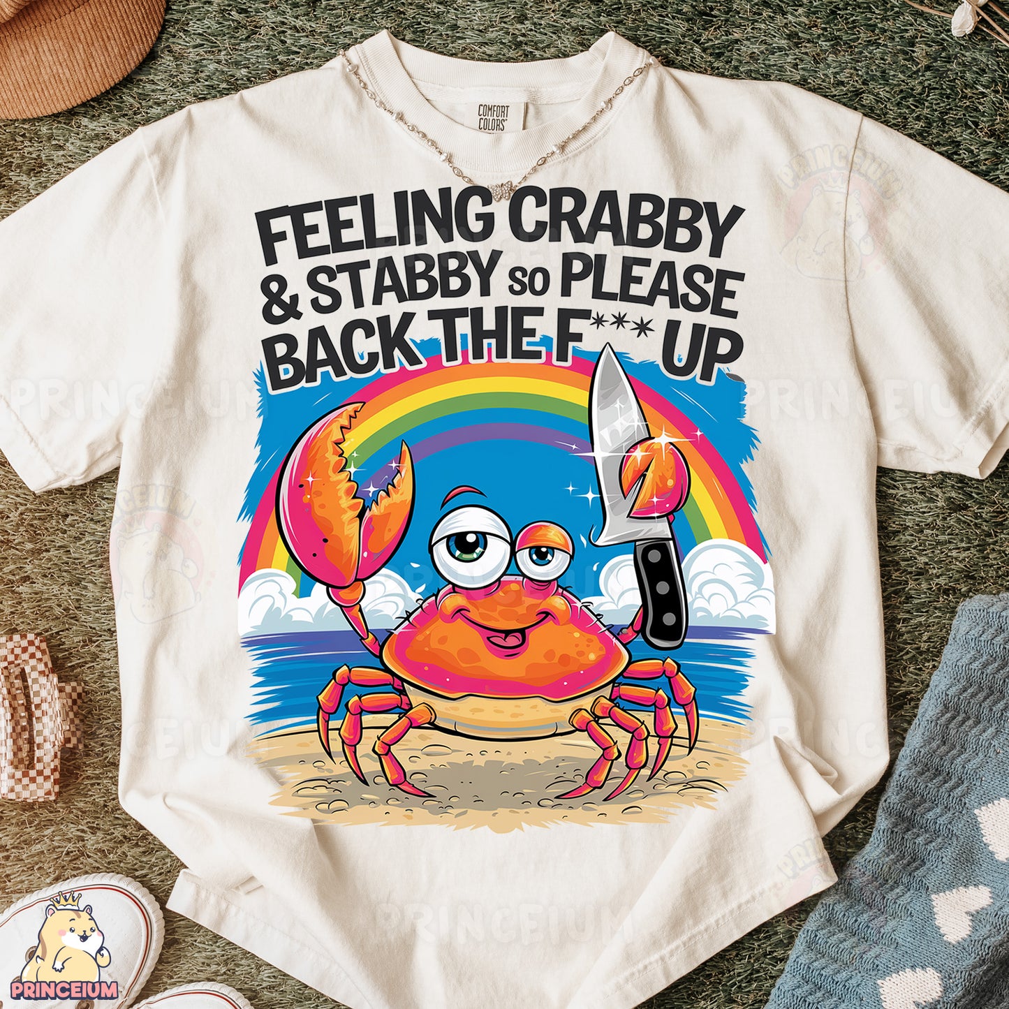 a t - shirt with a crab holding a knife