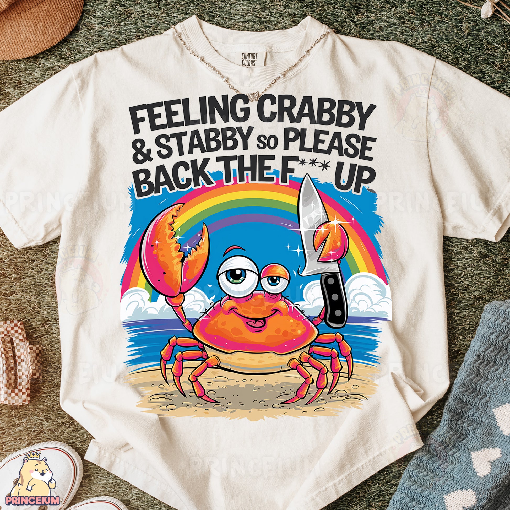 a t - shirt with a crab holding a knife
