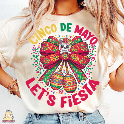 a woman wearing a cinco de mayo let's fiesta shirt