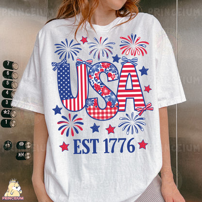 a woman wearing a usa t - shirt with fireworks