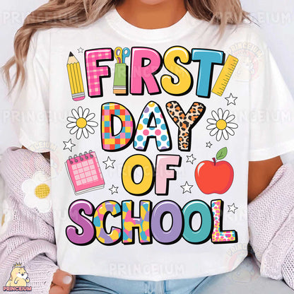 a woman wearing a t - shirt that says first day of school