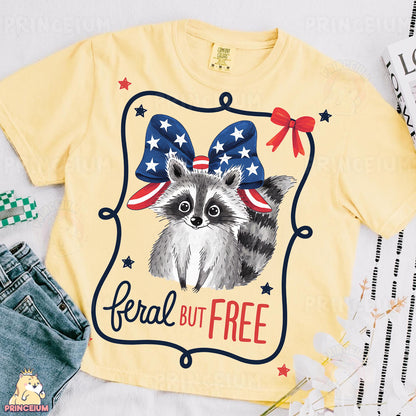 a t - shirt with a raccoon wearing a bow on it