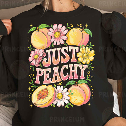 a woman wearing a black shirt that says just peachy
