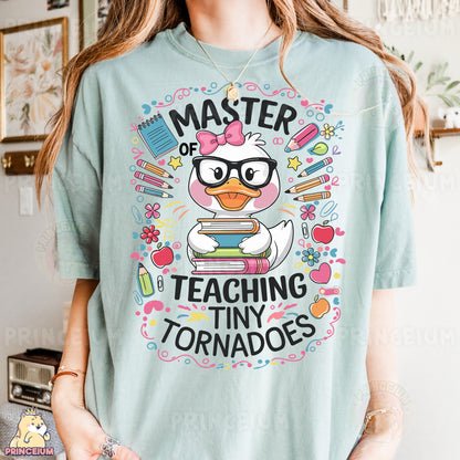 a girl wearing a t - shirt that says, master of teaching tiny tornados