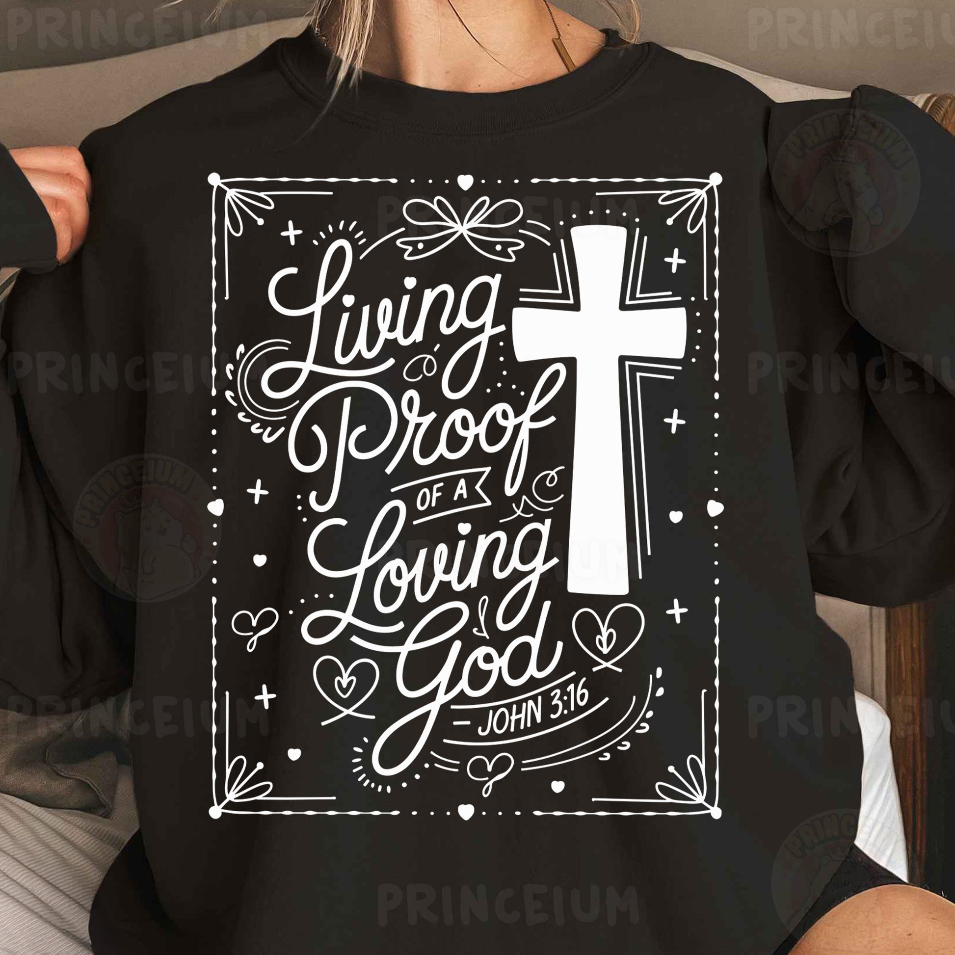 a woman wearing a black sweatshirt with a cross on it