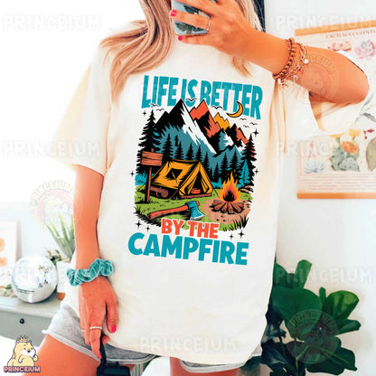 a woman taking a selfie while wearing a life is better by the campfire