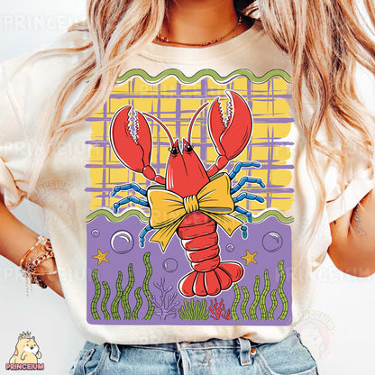 a woman wearing a t - shirt with a lobster on it