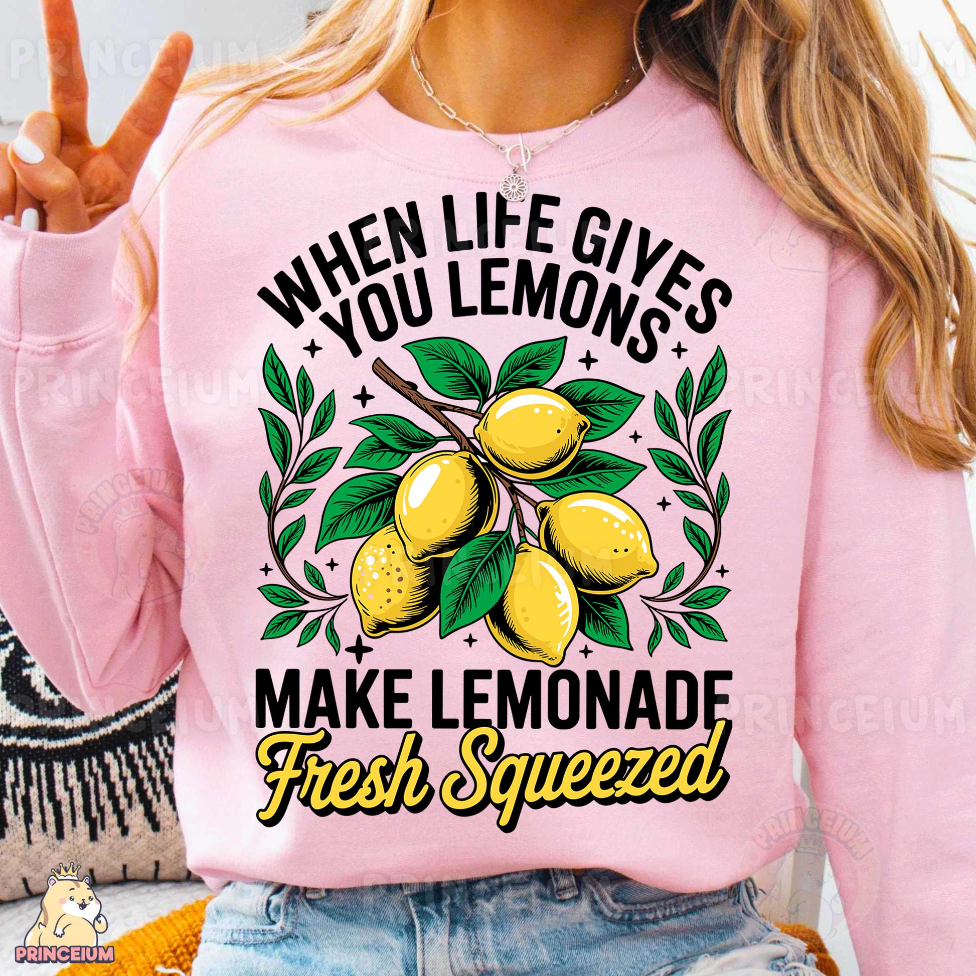 a woman wearing a pink sweatshirt that says when life gives you lemons make lemon