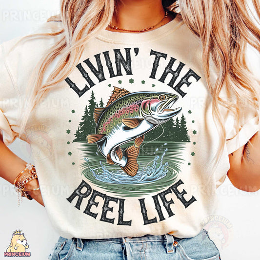 a woman wearing a t - shirt that says livvin'the reel life