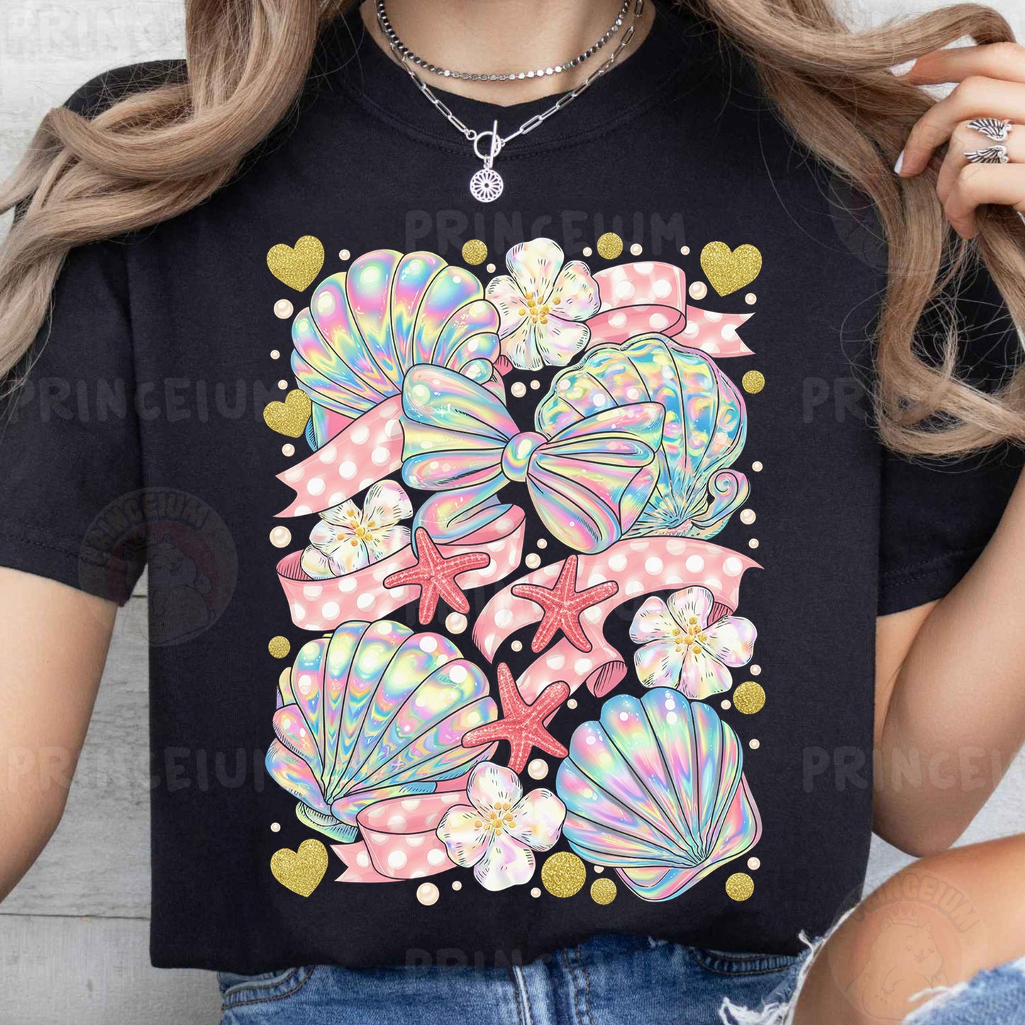 a woman wearing a black t - shirt with colorful seashells on it