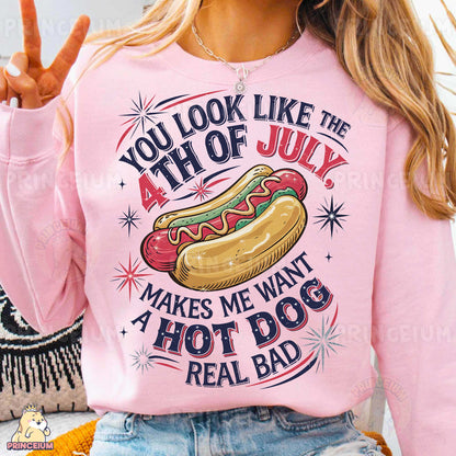 a woman wearing a pink shirt with a hot dog on it