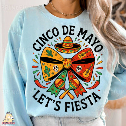 a woman wearing a cinco de mayo let's fiesta sweatshirt