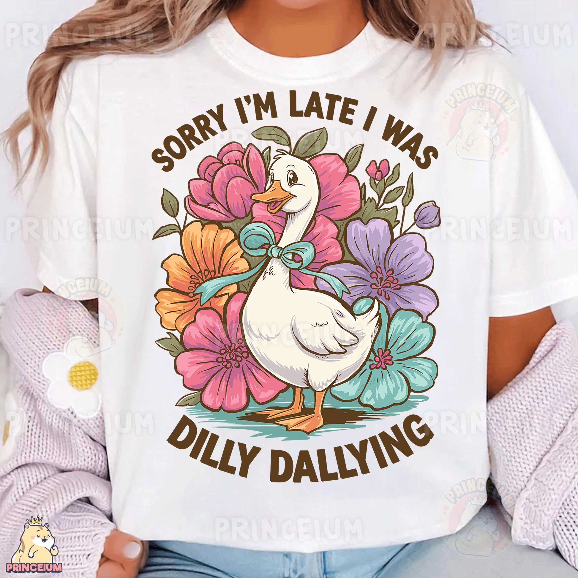 a woman wearing a white t - shirt with a duck and flowers on it