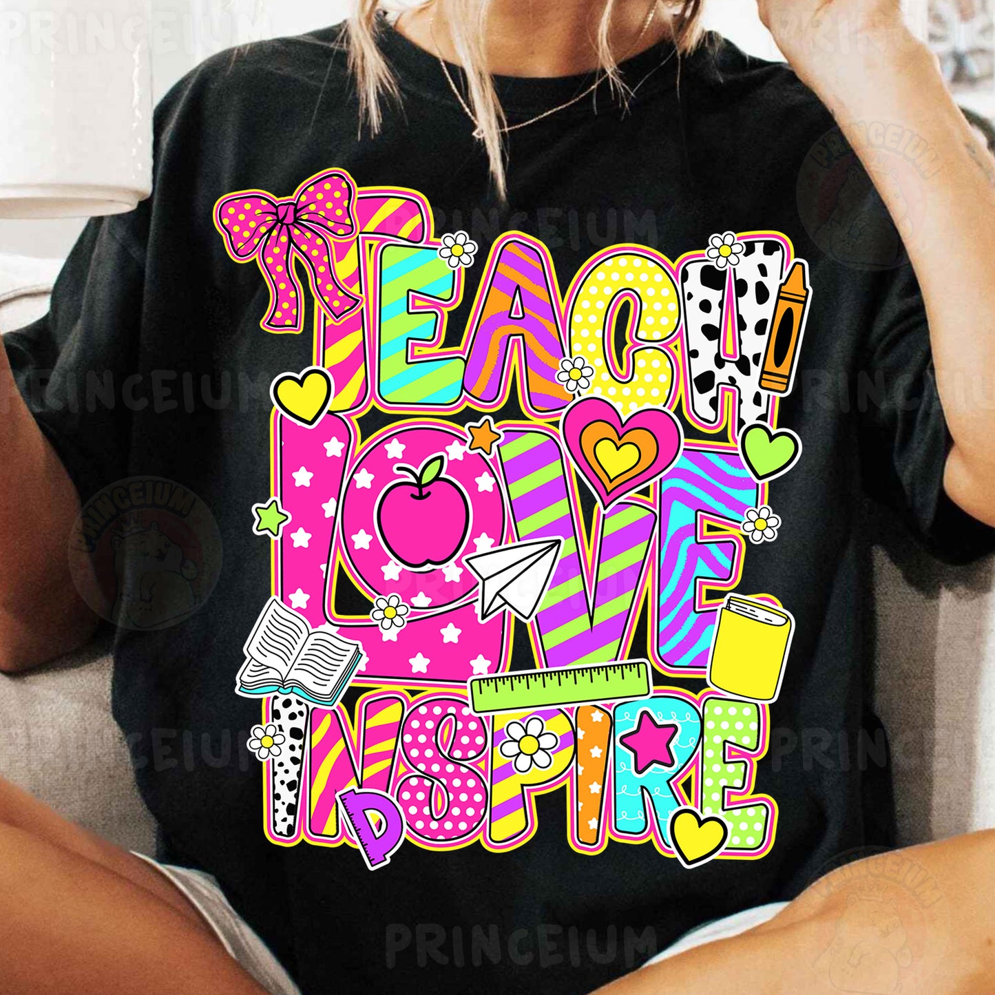 a woman sitting on a couch wearing a black t - shirt with the words peace