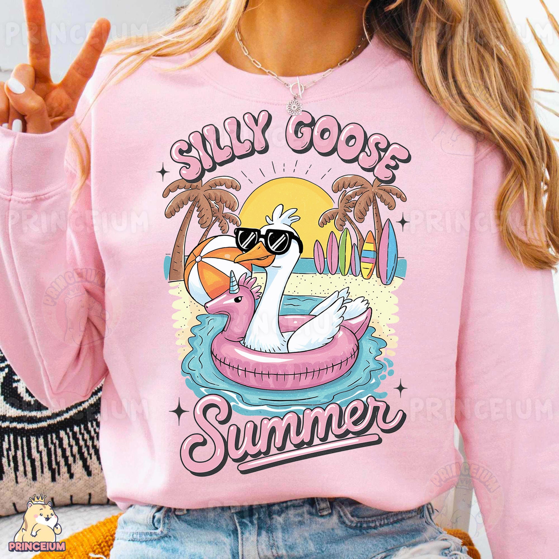 a woman wearing a pink sweatshirt with a flamingo on it