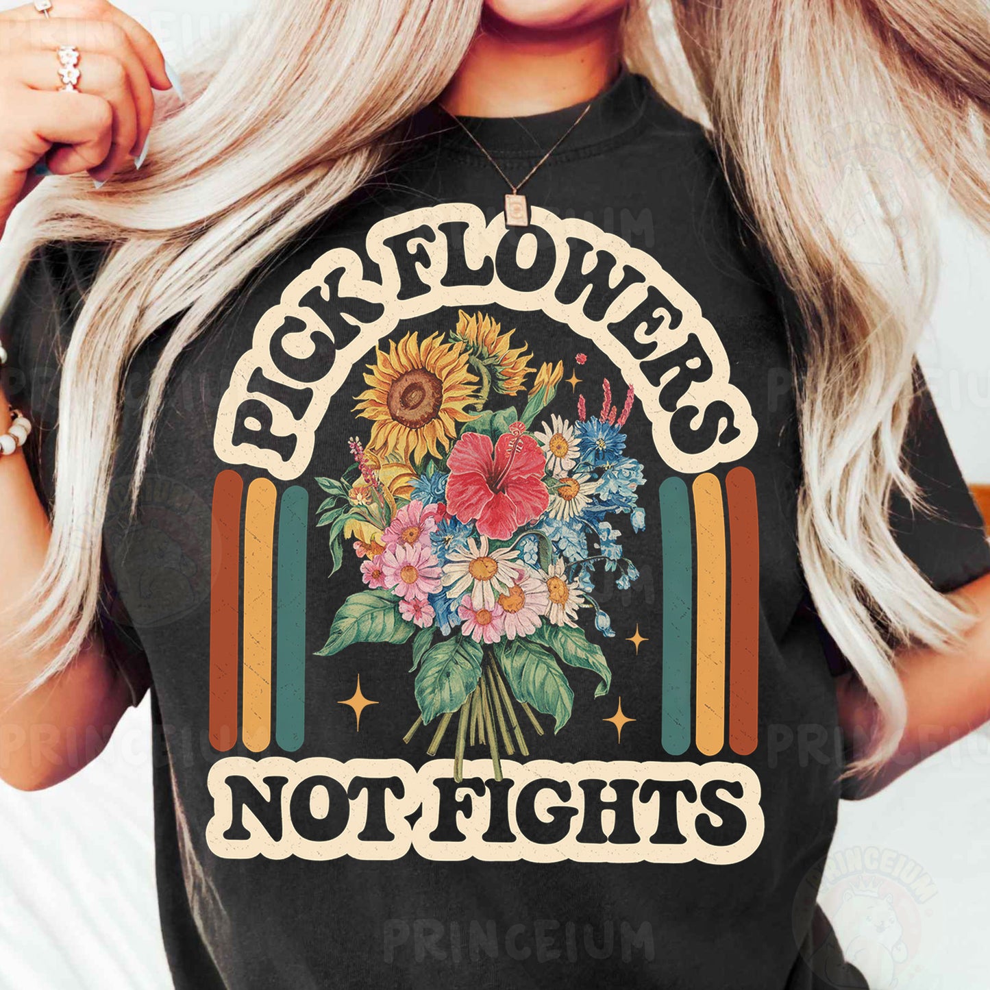 a woman wearing a black t - shirt with flowers on it