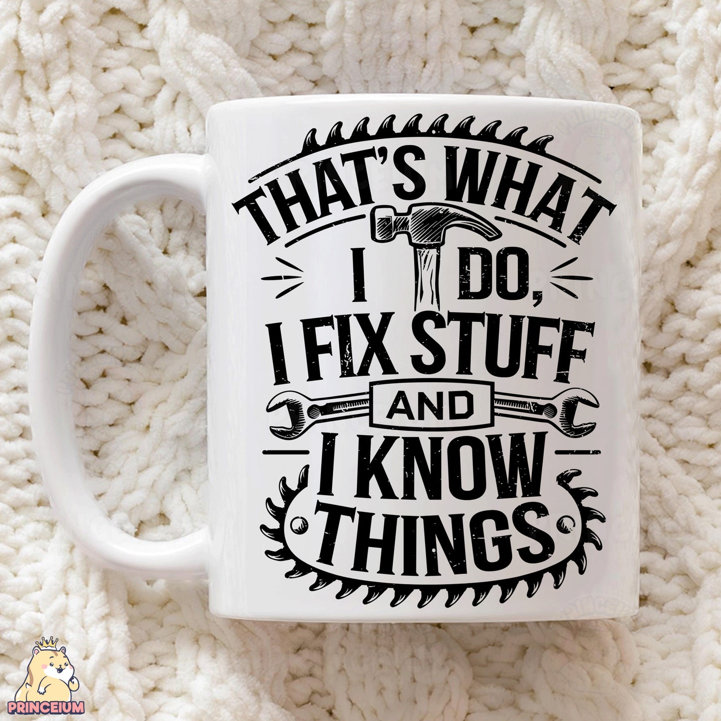 a white coffee mug sitting on top of a white blanket