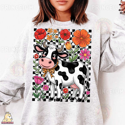 a woman wearing a sweatshirt with a cow on it