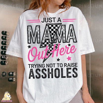 a woman wearing a t - shirt that says just a mama out there trying not