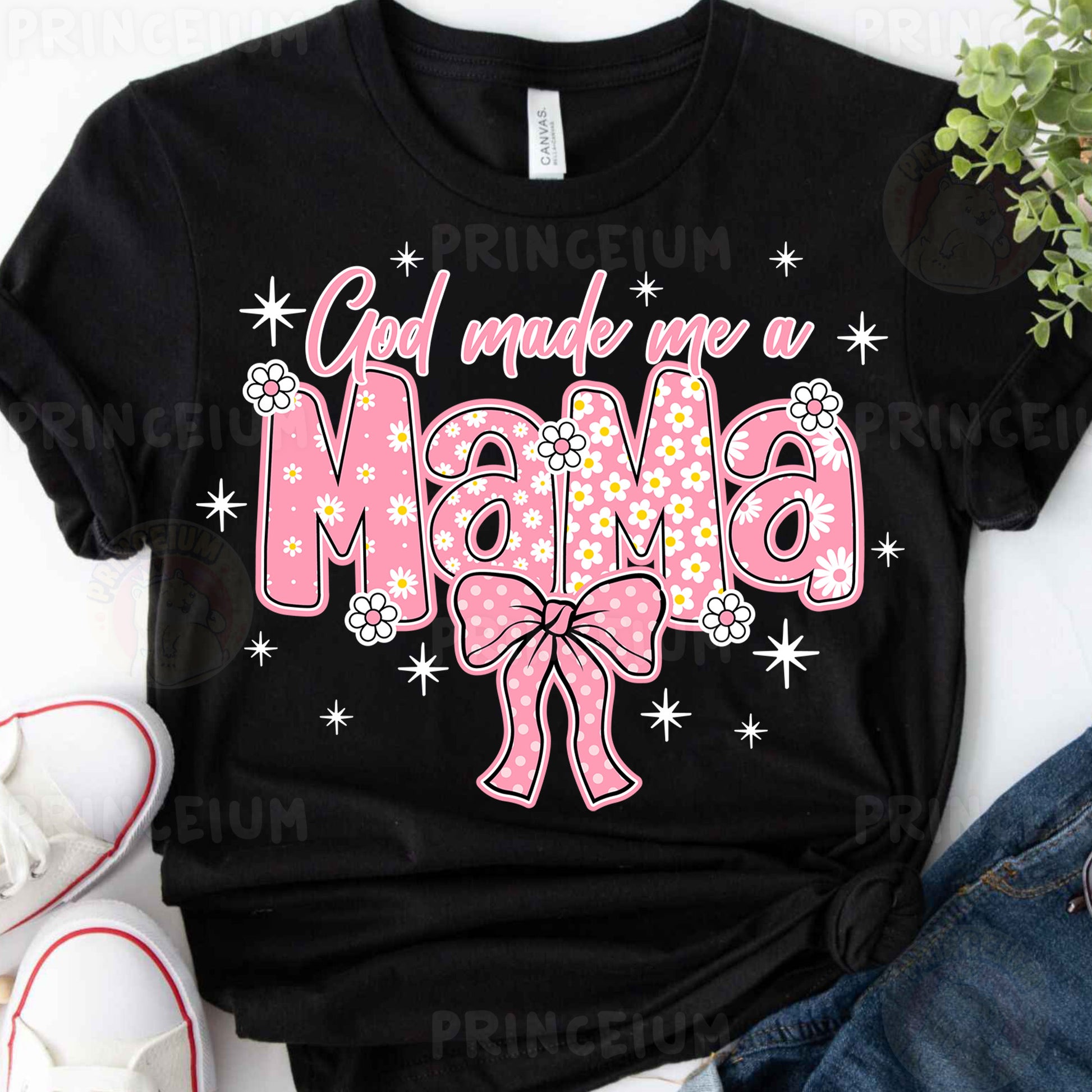 a black shirt with a pink bow on it