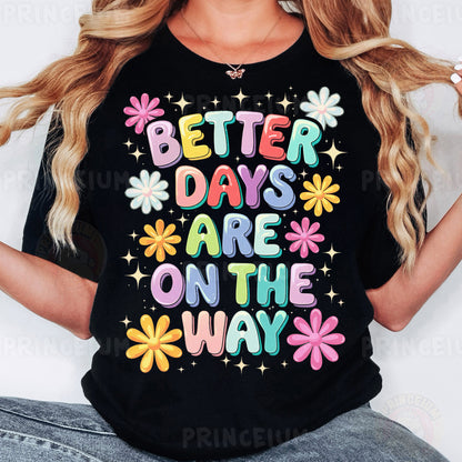 a woman wearing a black t - shirt that says better days are on the way