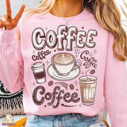 a woman wearing a pink sweatshirt with coffee on it