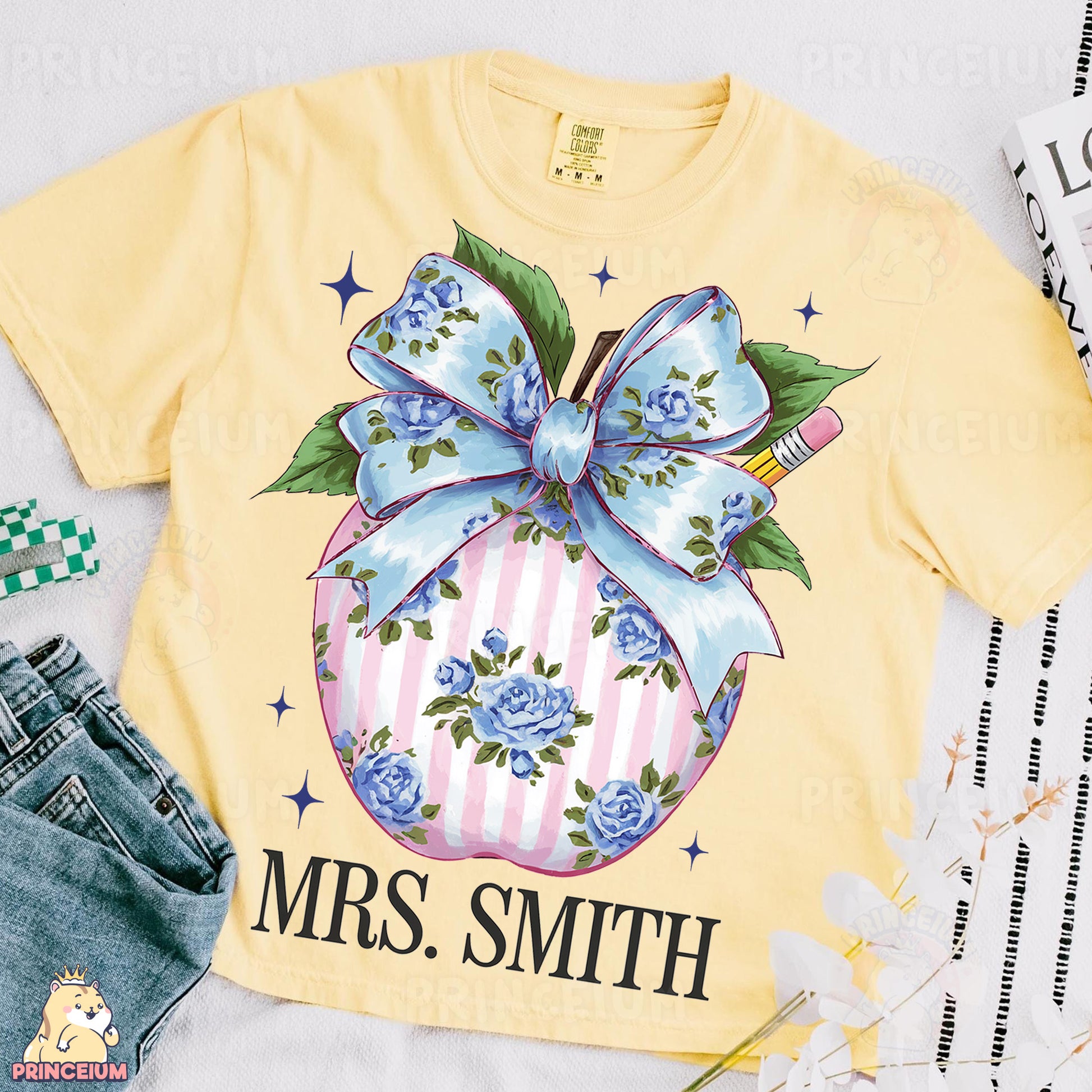 a yellow shirt with a blue bow on it