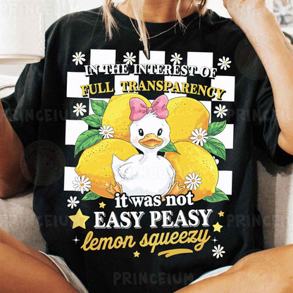 a woman sitting on a couch wearing a black shirt