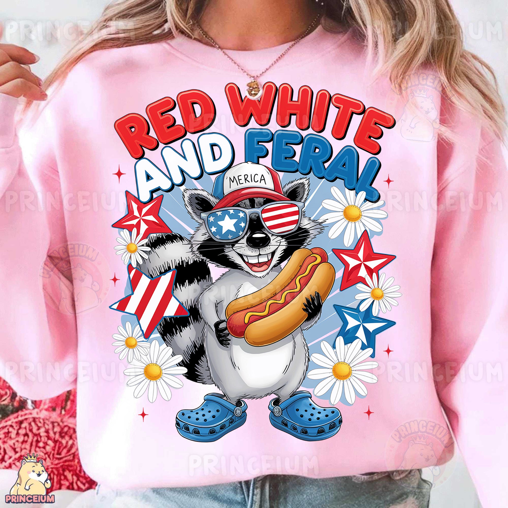 a woman wearing a pink sweatshirt with a raccoon eating a hot dog