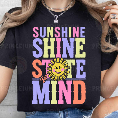 a woman wearing a black shirt that says sunshine shine and smile