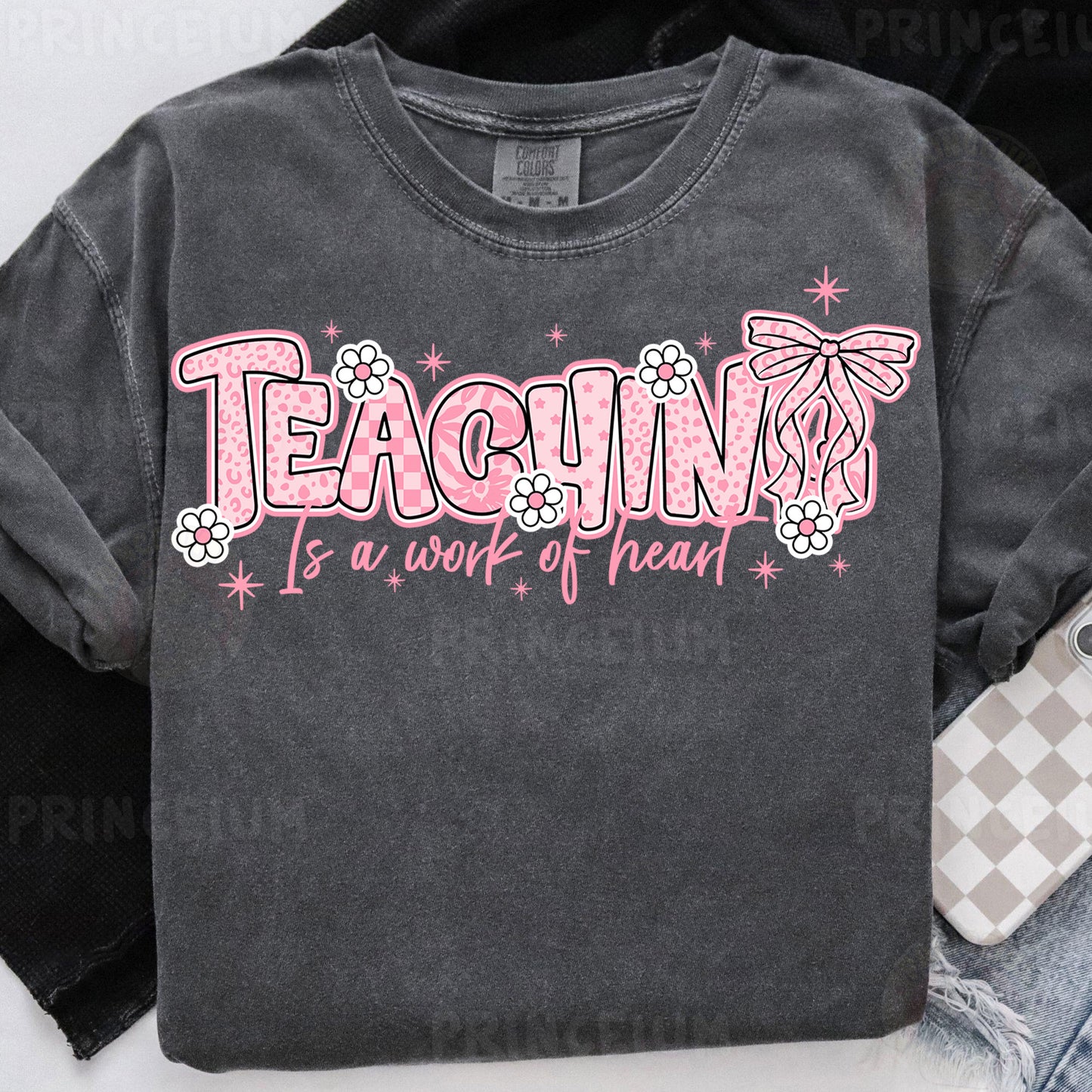 a t - shirt that says teaching is a work of heart