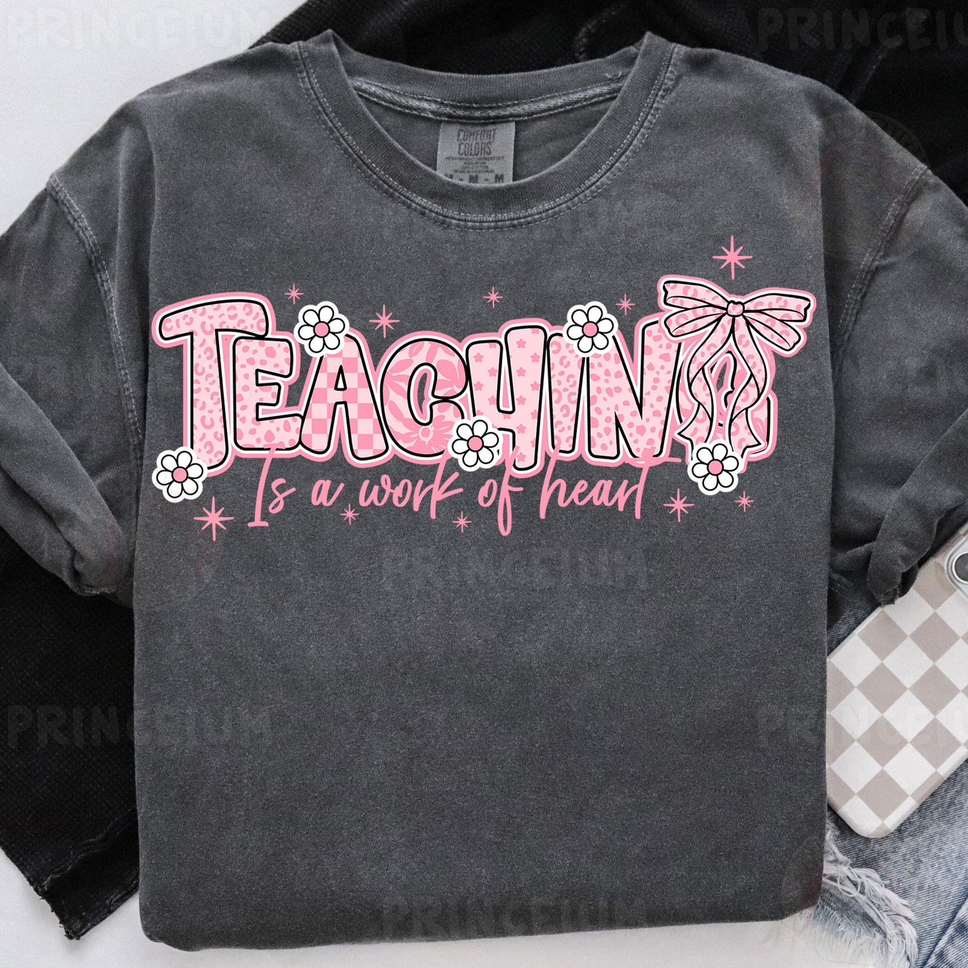 a t - shirt that says teaching is a work of heart