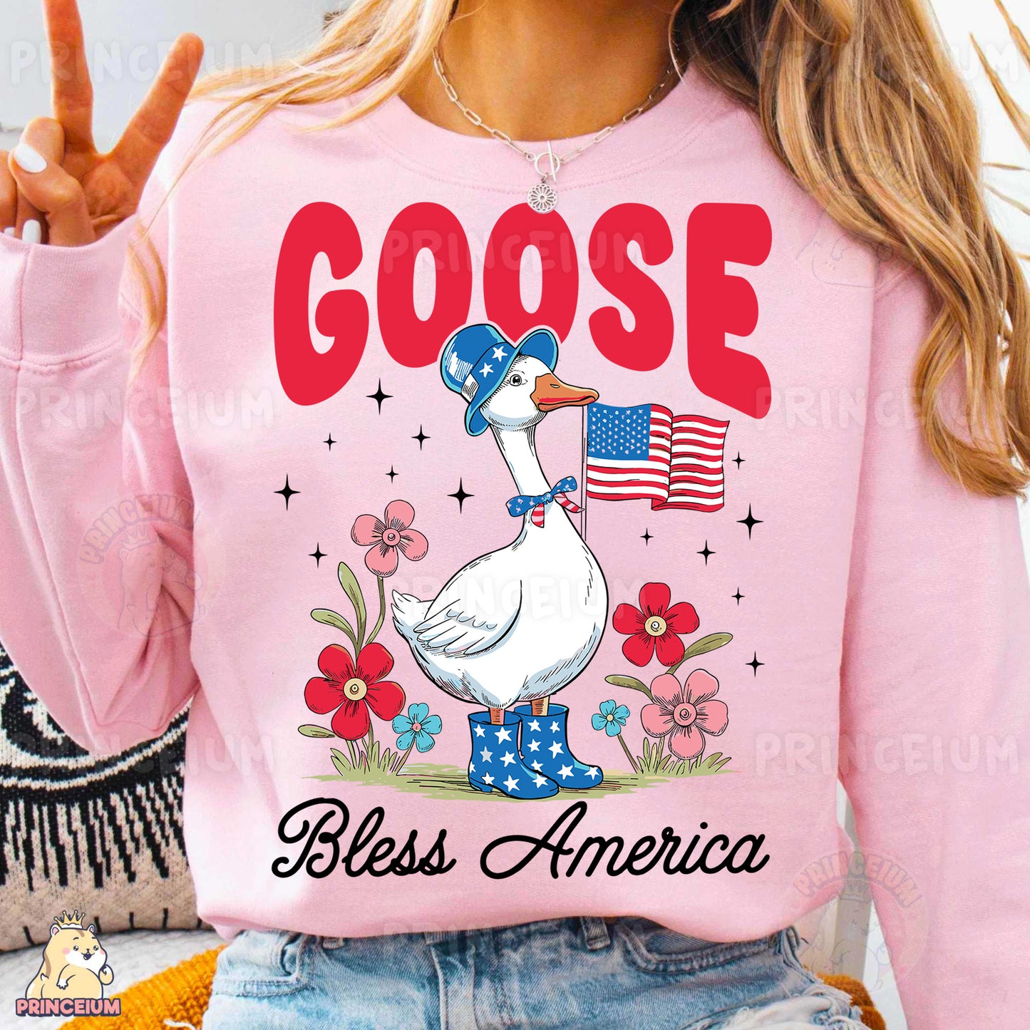 a woman wearing a goose shirt and jeans