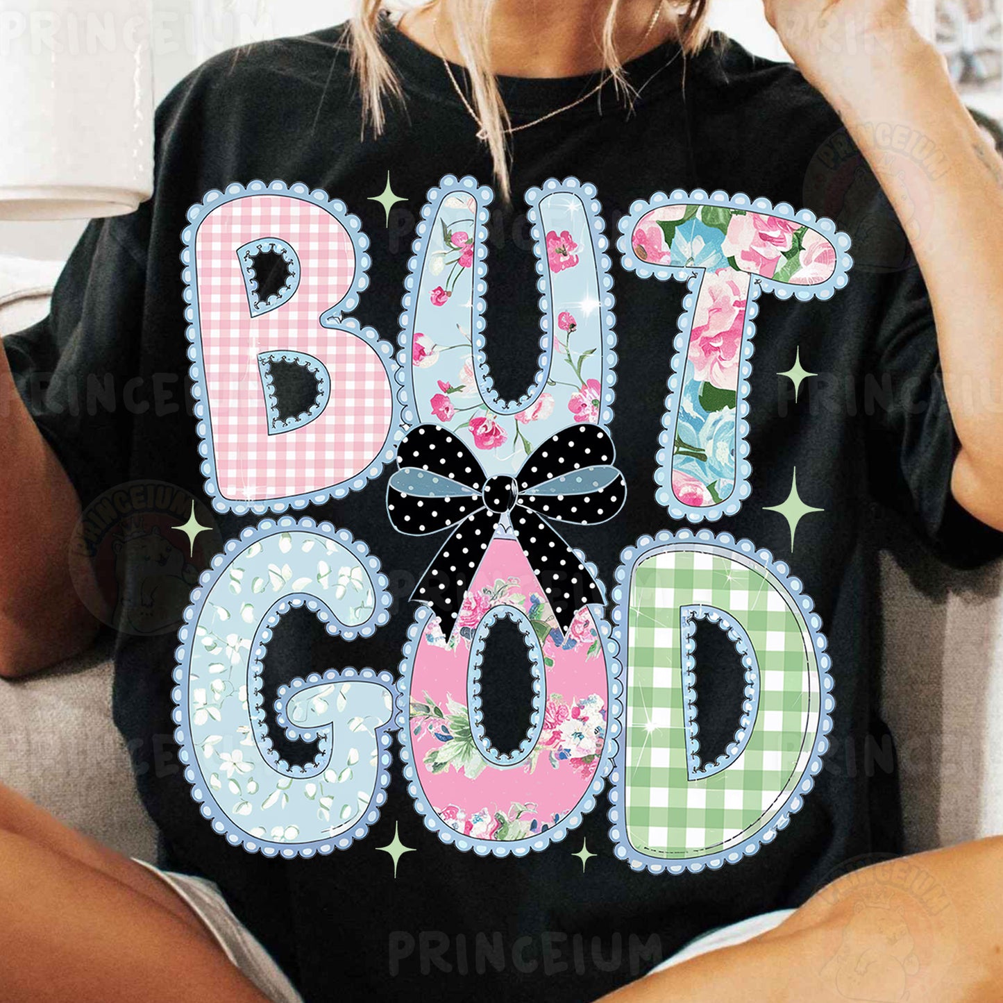 a woman sitting on a couch wearing a shirt that says but god