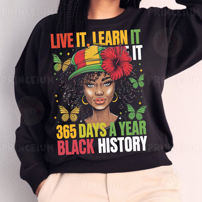 a woman wearing a black sweatshirt with a flower on it