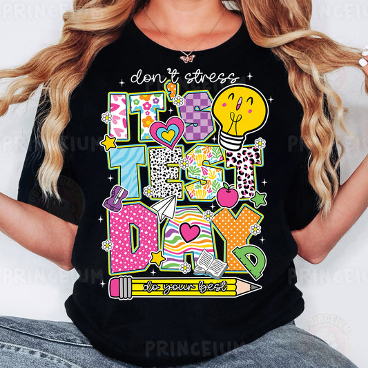 a woman wearing a black tshirt with a design on it