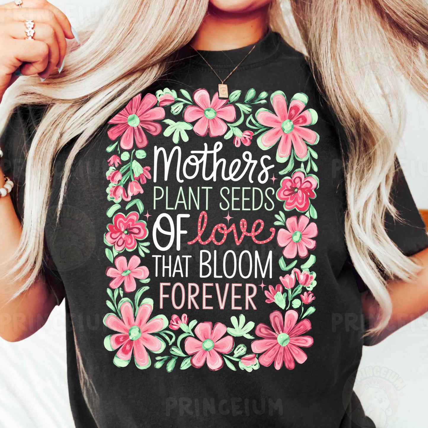 a woman wearing a t - shirt that says mother's plant seeds of love