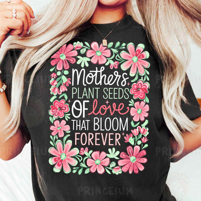 a woman wearing a t - shirt that says mother's plant seeds of love