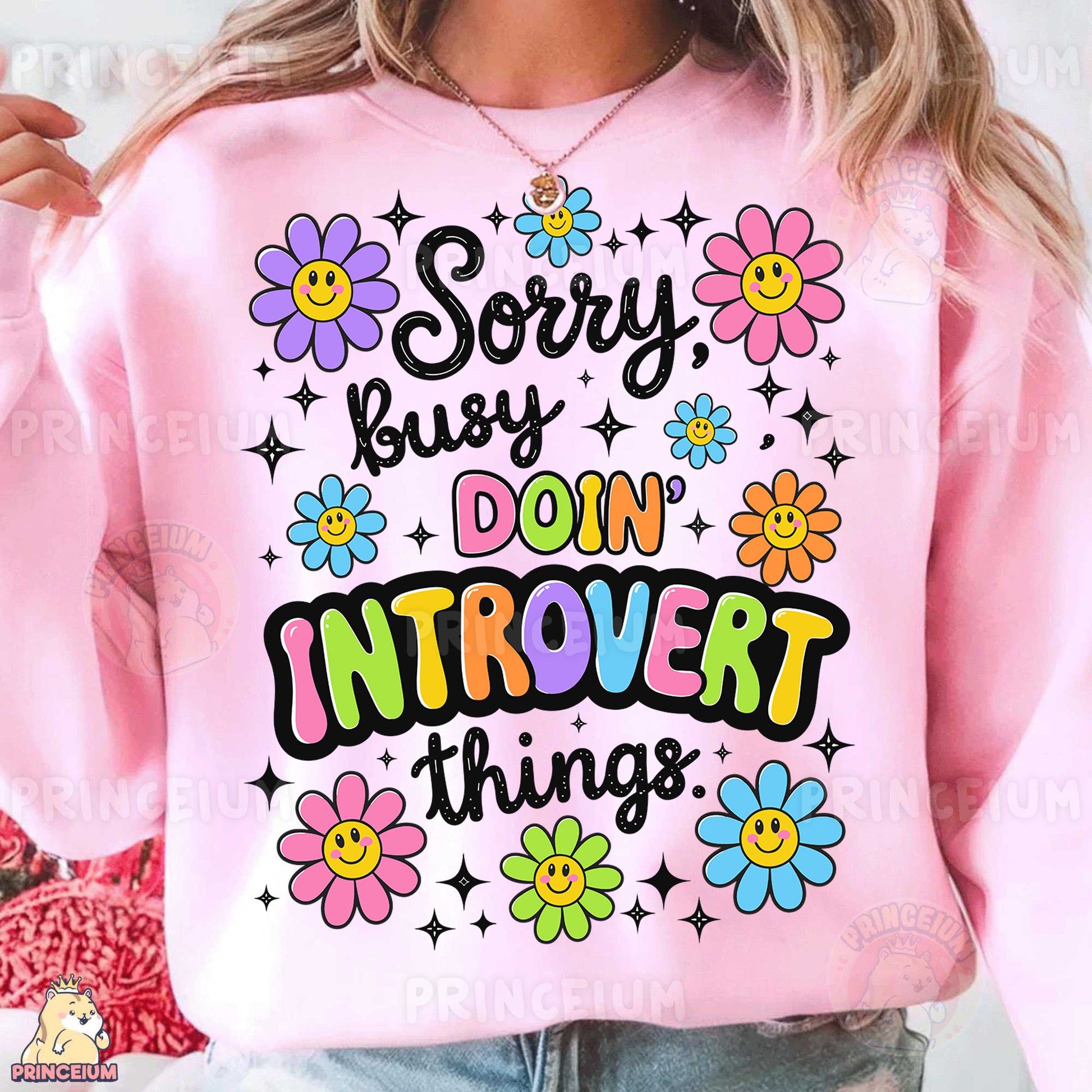 a woman wearing a pink sweatshirt that says sorry busy, don't intro things