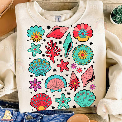 a t - shirt that has a bunch of seashells on it