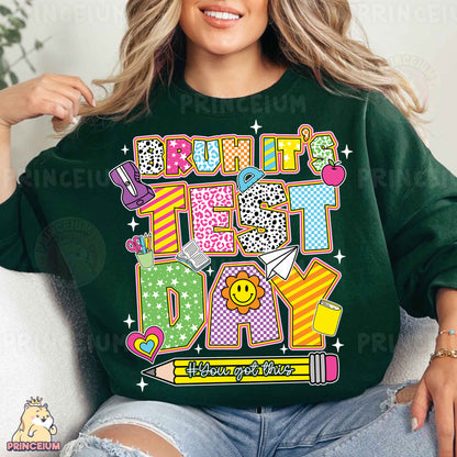 a woman sitting on a couch wearing a green shirt