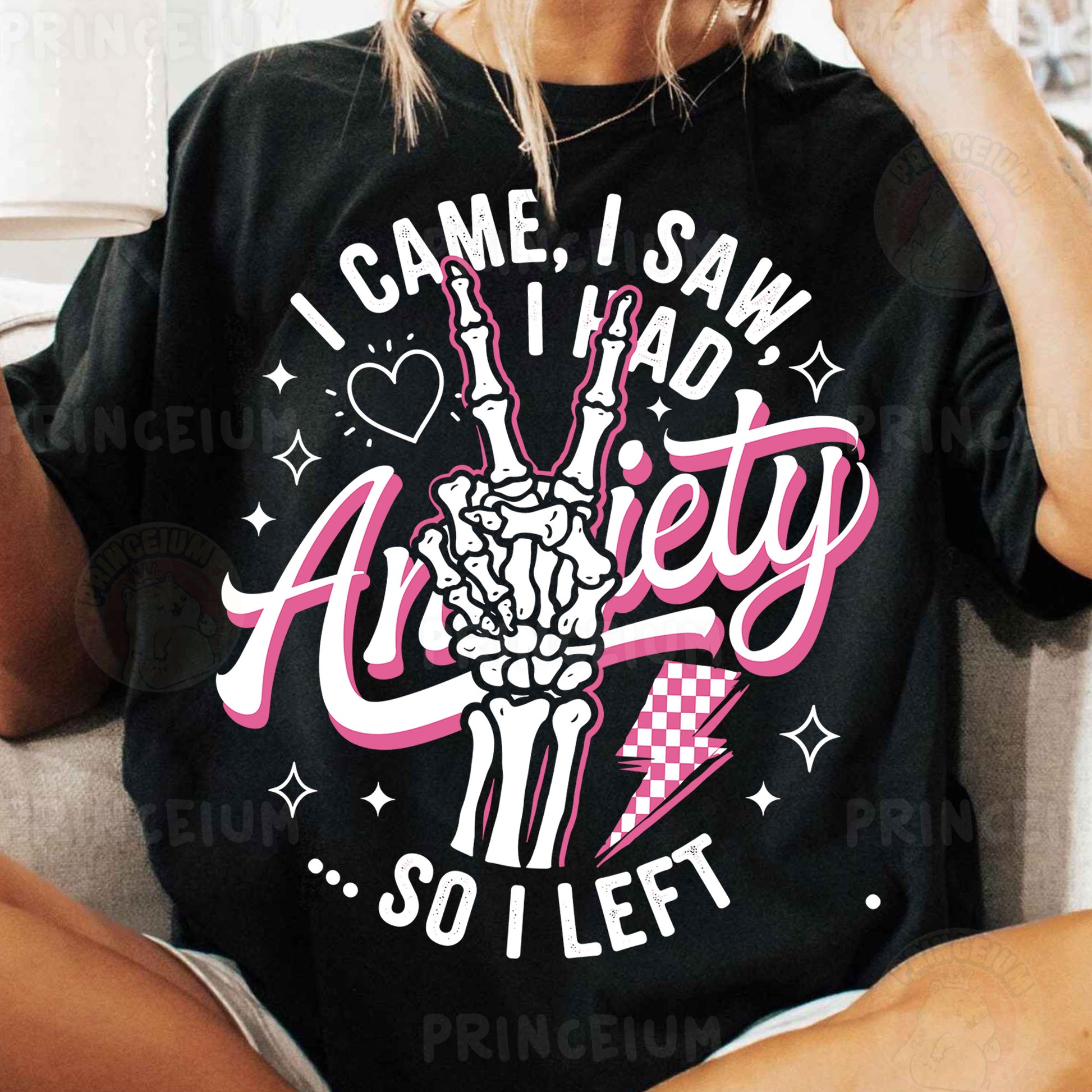 a woman sitting on a couch wearing a t - shirt that says i came i