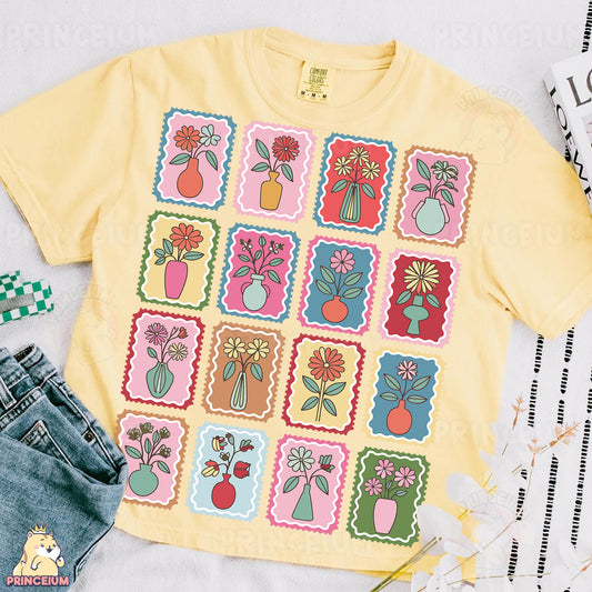 a t - shirt that has a bunch of flowers on it