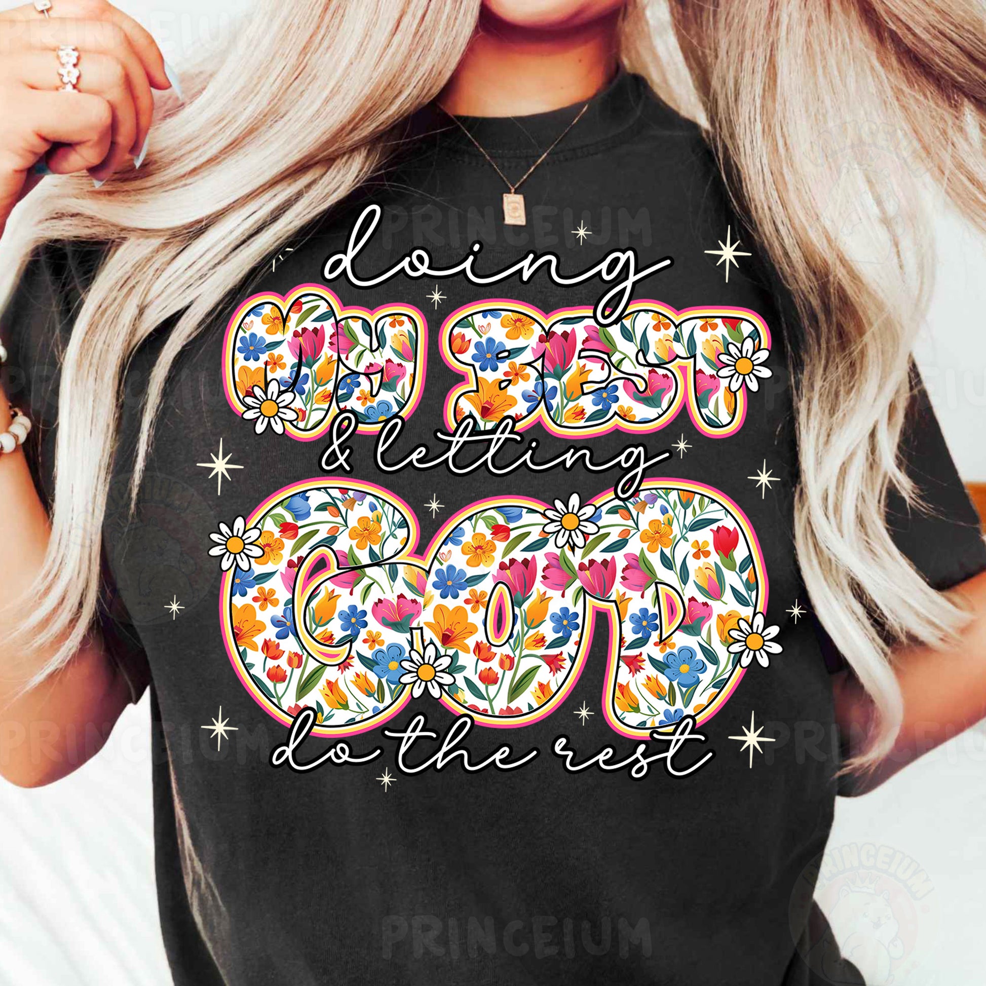 a woman wearing a black t - shirt with a floral design