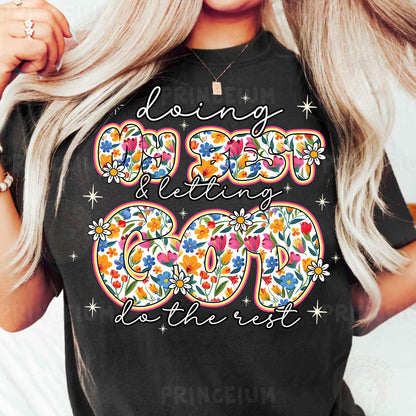 a woman wearing a black t - shirt with a floral design