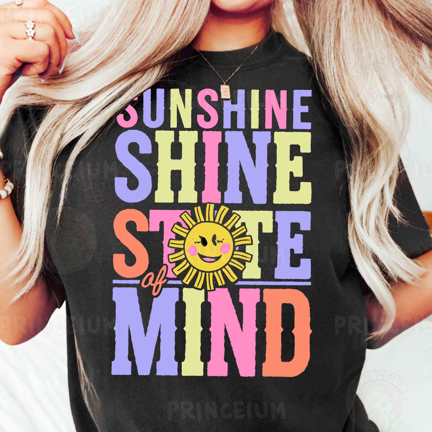 a woman with blonde hair wearing a black sunshine shirt