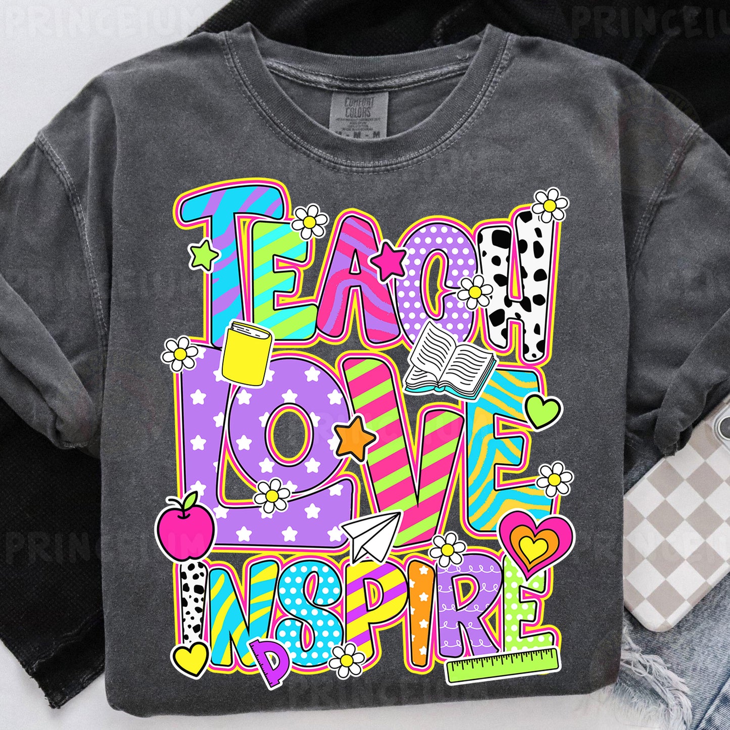a t - shirt with the words teach love inspire on it
