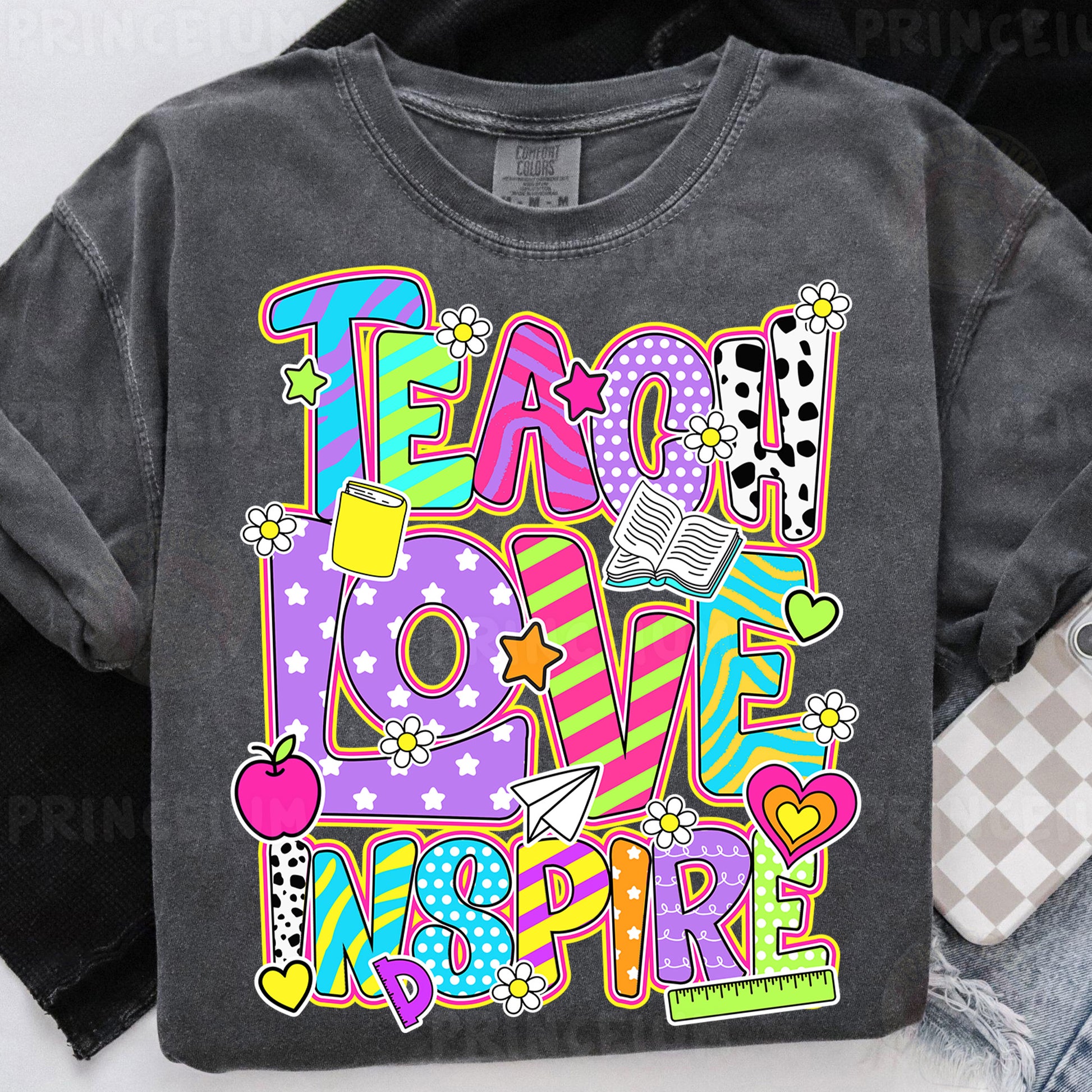 a t - shirt with the words teach love inspire on it