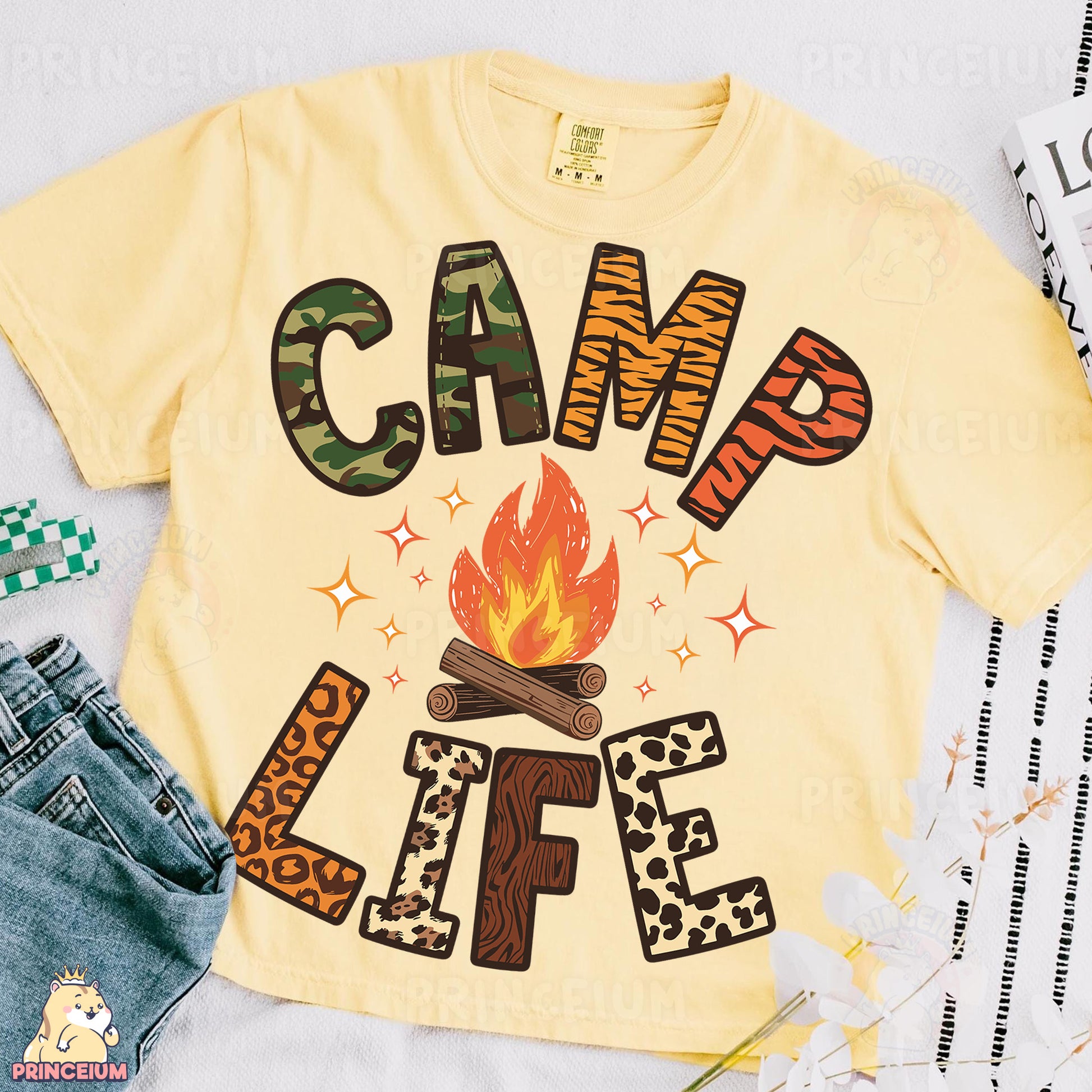 a shirt that says camp life next to a pair of jeans